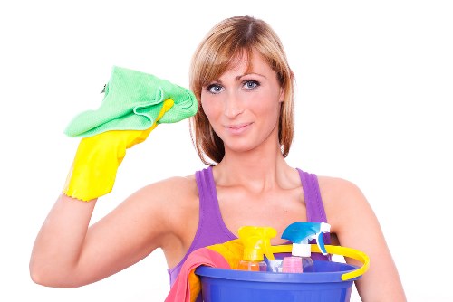 Airbnb cleaning service preparing a guest-ready living room in KT2