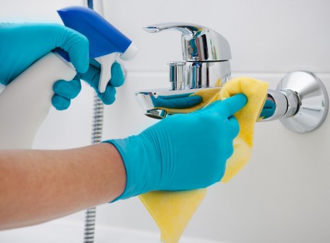 Freshening a family sofa during upholstery cleaning in KT2